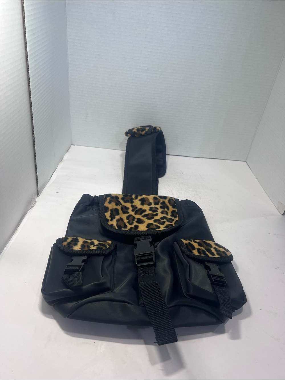 Arizona Jean Company Black Sling Backpack with Leopard Print Accents